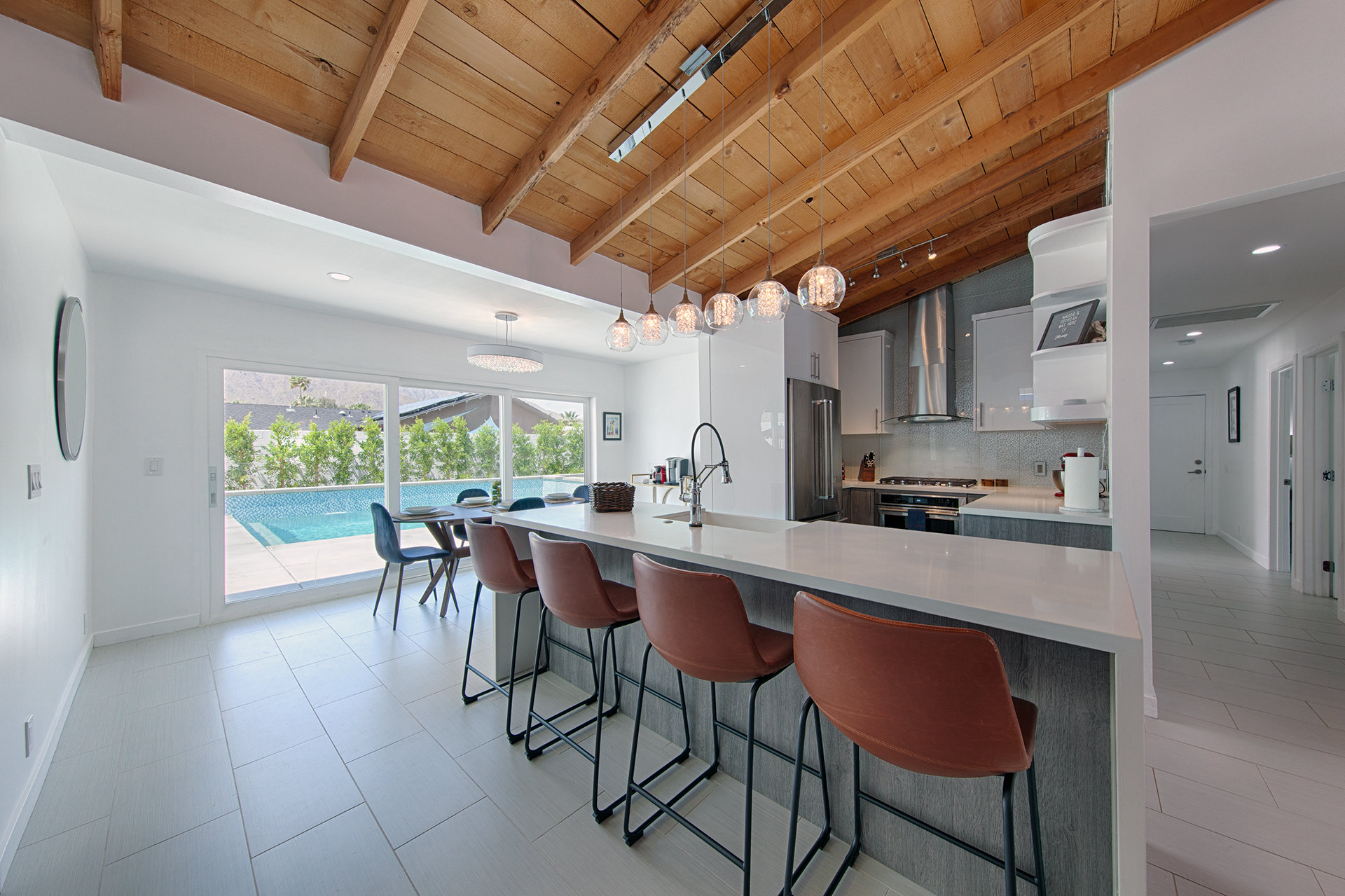 Remodled kitchen with leather stools in a home in Palm Springs, California