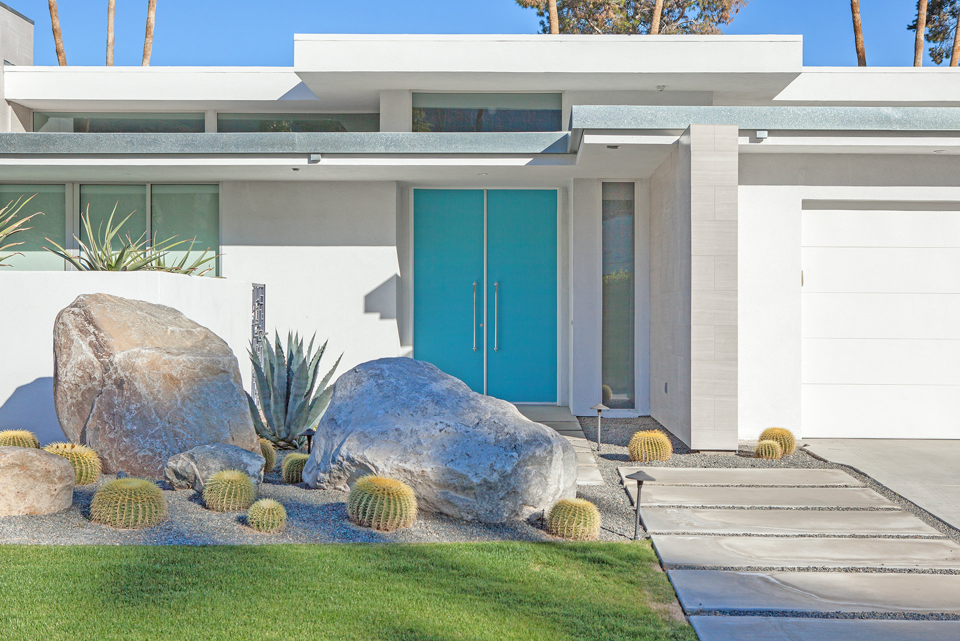 A mid-century home with blue door in Indian Canyons, Palm Springs, CA