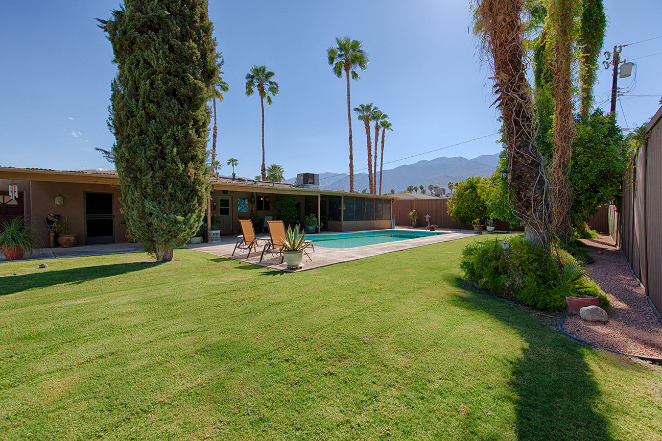 The lawn and pool in the backyard of a home in Demuth Park, Palm Springs.