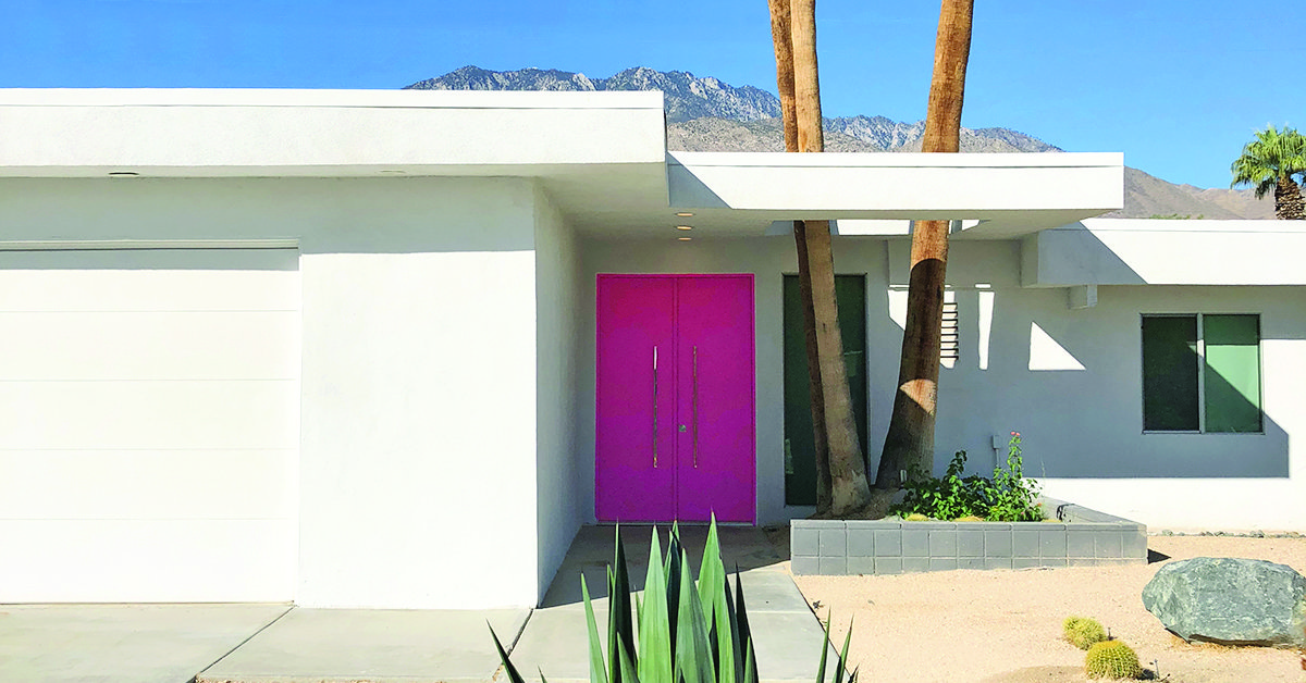 A home with a pink door in the Little Beverly Hills neighborhood of Palm Springs, CA
