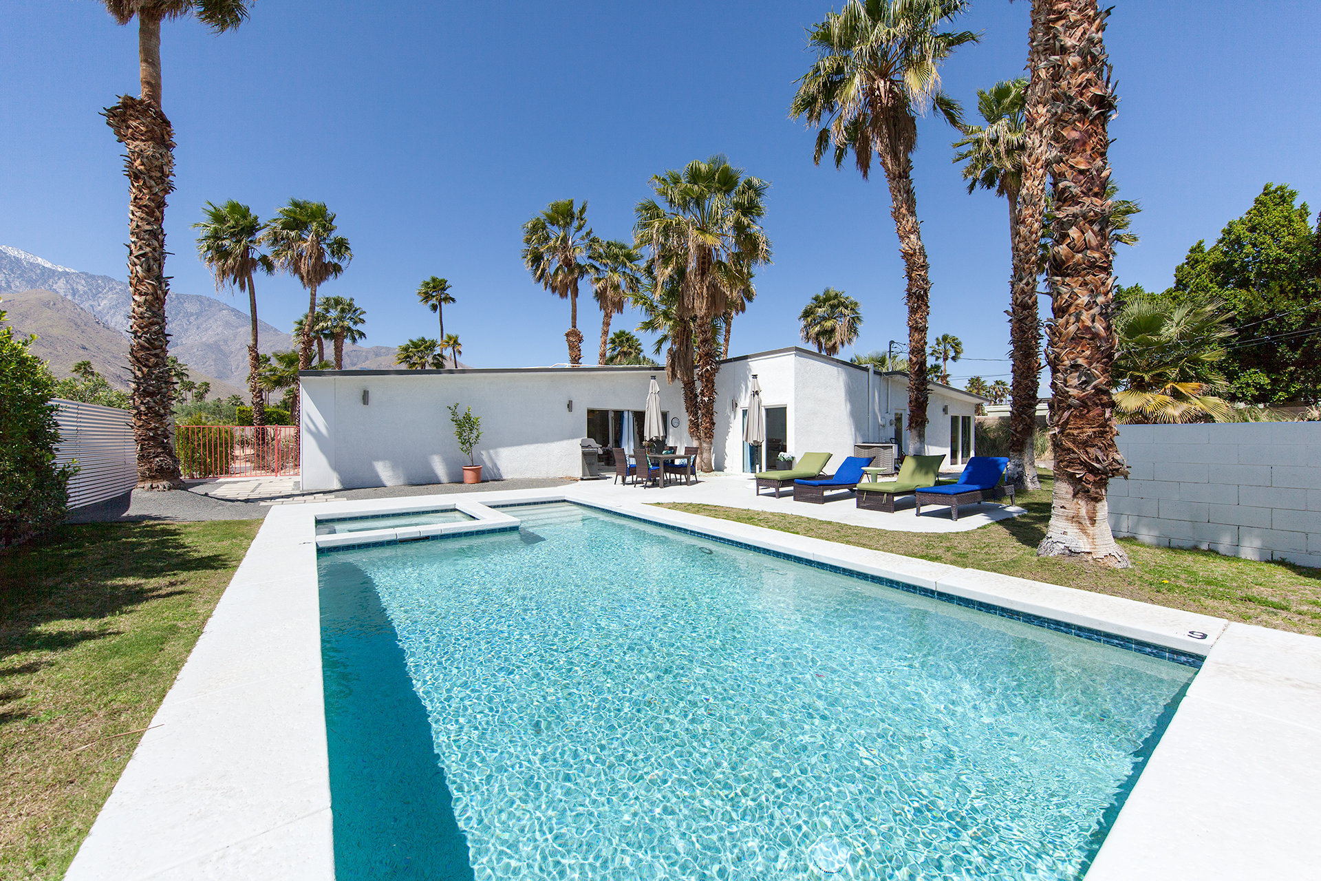 A backyard pool and mid-century modern home in Racquet Club Estates, Palm Springs, CA